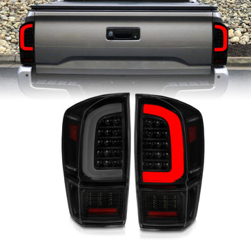 Luces traseras LED ANZO 16-21 Toyota Tacoma - con barra de luces secuencial, carcasa negra y lente ahumada