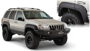 Bushwacker 99-04 Jeep Grand Cherokee bengalas estilo recortado 2 piezas - negro